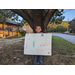 Andrew Dowdell holding his winning poster