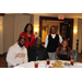 CEO Tolbert posing with attendees at dinner table