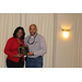 CEO Sharon Tolbert recognized Greg Moore with plaque for his 10 years of service