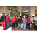 Employees and Commissioners at the Christmas Luncheon posing in front of Christmas tree