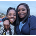 Mother and daughter posing at Christmas event