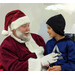 Santa speaking with a young boy