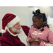 Santa speaking with a young girl