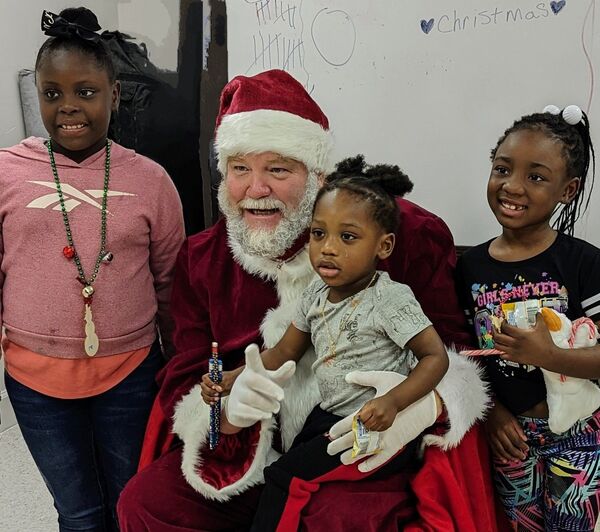 Santa and three little girls 