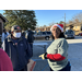 Market Volunteer wearing Santa hat 