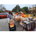 Thanksgiving Farmers Market setup outside with boxes of food.