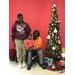 Tawanda McClaney and family at community Christmas tree 
