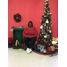 Willie Avery sitting at community Christmas tree