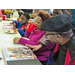 Senior citizens participating in BraveHearts luncheon with youth at lunch table