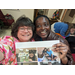 Mrs. Charlotte Mattox and BraveHearts volunteer holding a collage