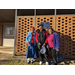 Senior participants standing outside Porter Community Building brick wall