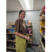 Volunteer inside food pantry posing