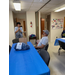 Male Wonderful Wednesday attendee speaking with a student from Auburn University
