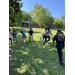 Children running on the lawn with easter baskets in their hands