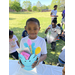 Little boy smiling holding an easter basket