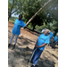  Two AHA senior residents standing outside in matching tshirts at the Older Americans Month celebration 