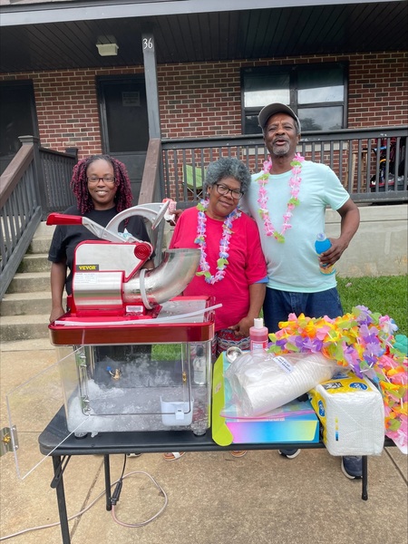 SummerSnow9.jpg Volunteers behind snowcone table