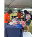  community members at Auburn Housing Authority vendor table getting resources 