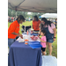  community members at AHA vendor table getting resources 