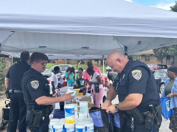 Auburn Police Department filling up tote bags with school supplies