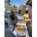  Resdient receiving fruit and veggies at farmers market  
