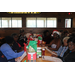  Seniors at the table at the BBQ restaurant.  Santa gift bags are in front of each senior on the table 