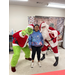  The Grinch and Santa with a young girl  