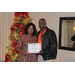  CEO Sharon Tolbert recognizing Commissioner Alton Joiner (5 years, also bidding farewell) in front of Christmas tree 