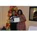  Sharon Tolbert recognizing Dominique Moore (5 years) in front of the Christmas tree at the Christmas luncheon 