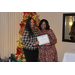  Sharon Tolbert recognizing Esmerelda Smith for completing her TBV Specialist certification in front of the Christmas tree 