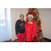  Older women at the Christmas luncheon for Auburn Housing Authority standing in front of the Christmas tree 