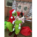  The grinch holding a baby girl 
