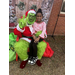  The Grinch posed with a girl in a pink shirt 