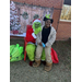  The Grinch posed with a young girl outside 