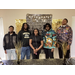  LaFayette Housing Authority Class of 2026 graduates at their graduation reception in front of a congratulations banner 