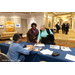  Commissioners checking in at the checkin table for the scholarship breakfast 