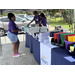 Eastern Star volunteers passing out supplies to parent 