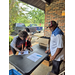  Commissioner Holloway helping check in residents at the Back to School bash  