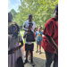  Families standing in line waiting for the Back to School giveaway to begin  