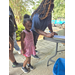  Family signing in to receive the Back to School Bash giveway items  